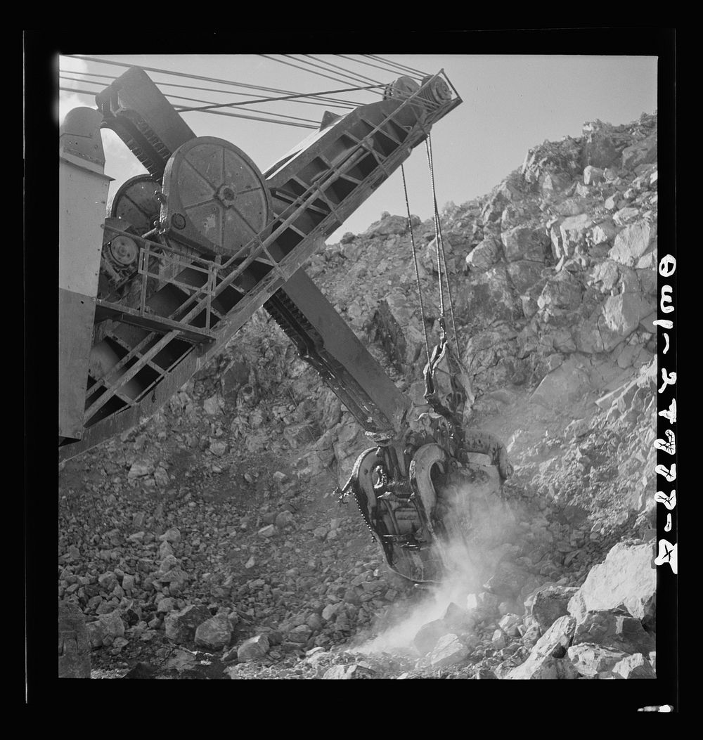 Morenci, Arizona. An electric shovel operating in an open-pit copper mine of the Phelps Dodge mining corporation. Sourced…