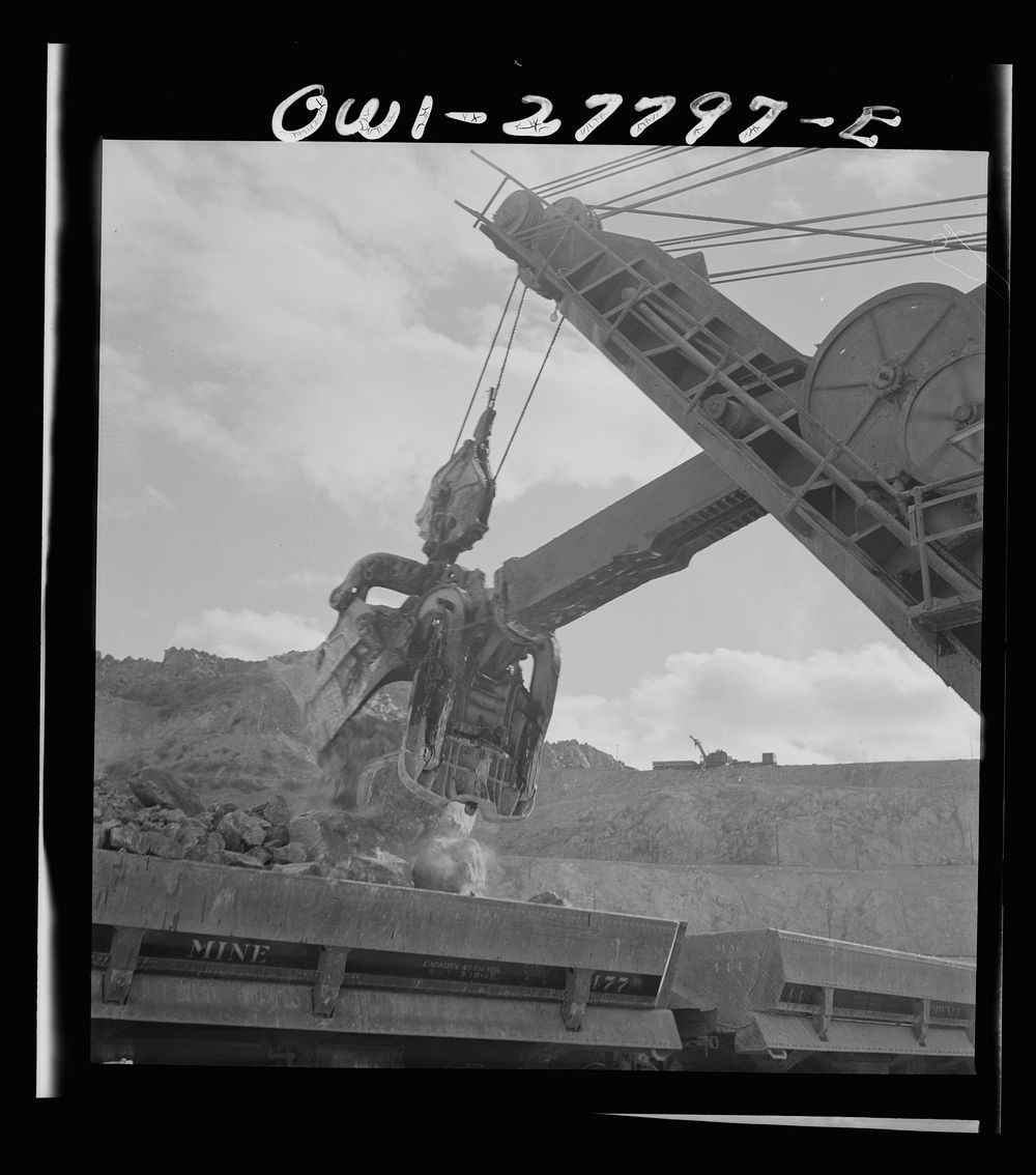 [Untitled photo, possibly related to: Morenci, Arizona. A huge electric shovel at an open-pit copper mine loading an ore…