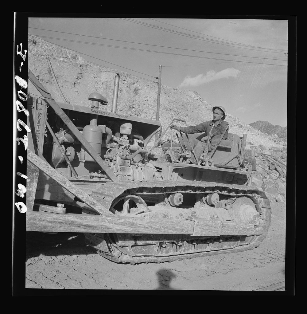 Morenci, Arizona. Bulldozer in operation at an open-pit copper mine of the Phelps Dodge mining corporation. Sourced from the…