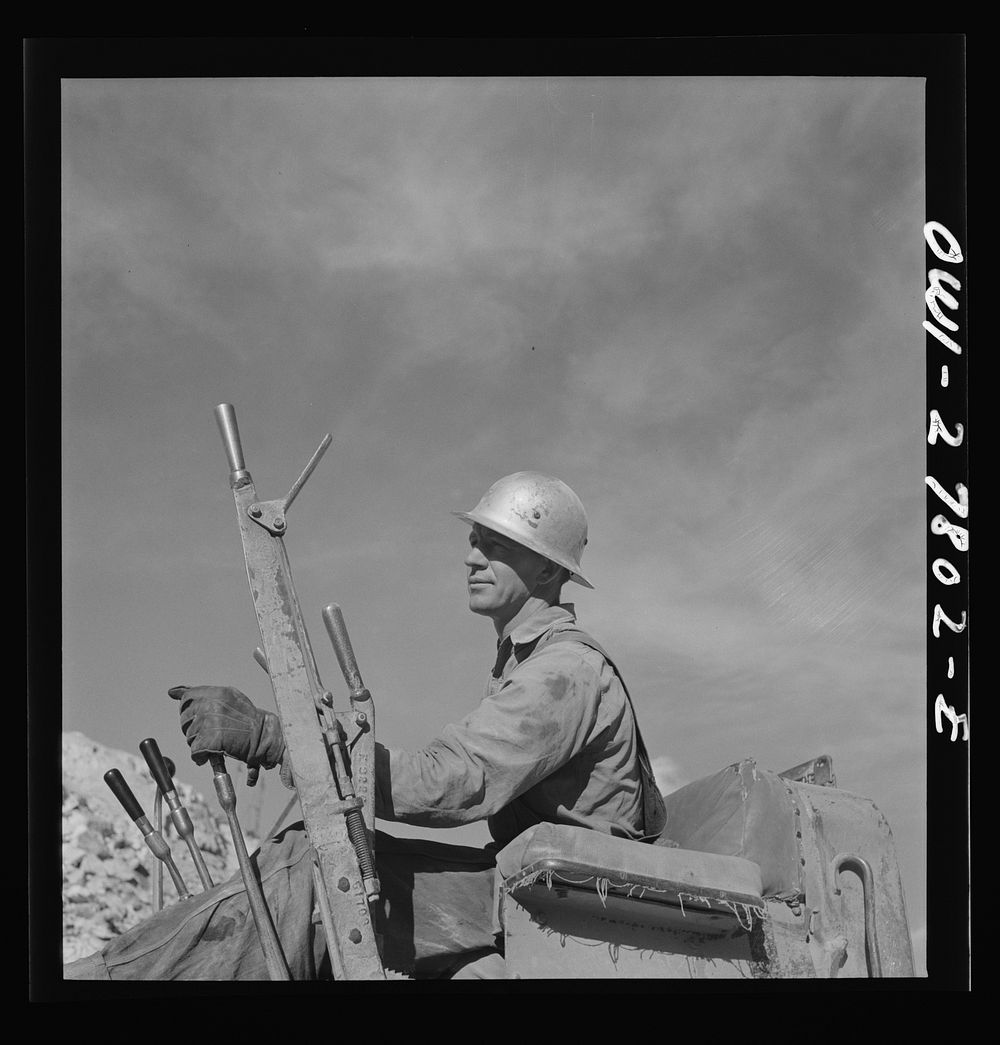 Morenci, Arizona. Bulldozer operator at an open-pit copper mine on the Phelps Dodge mining corporation. Sourced from the…