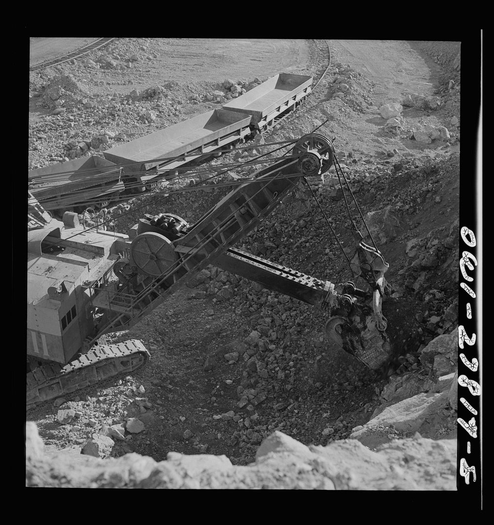 Morenci, Arizona. A huge electric shovel loads an ore train at an open-pit copper mine of the Phelps Dodge mining…