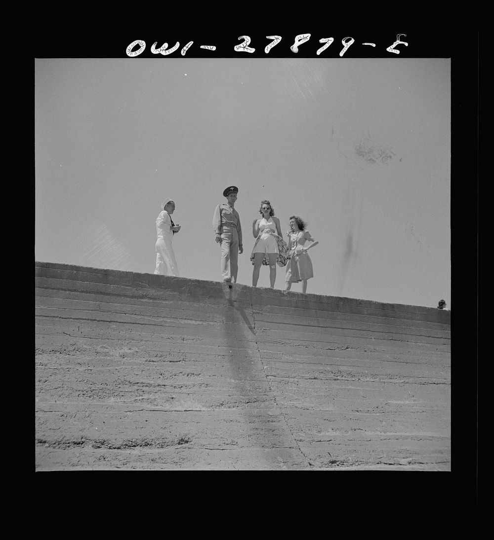 Galveston, Texas. Soldier, sailor, and two girls on the seawall. Sourced from the Library of Congress.