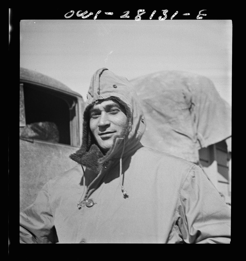 Somewhere in Iran. Jack Tchernawitz, a Russian-born United States Army Major of New York, New York, wearing his parka at a…
