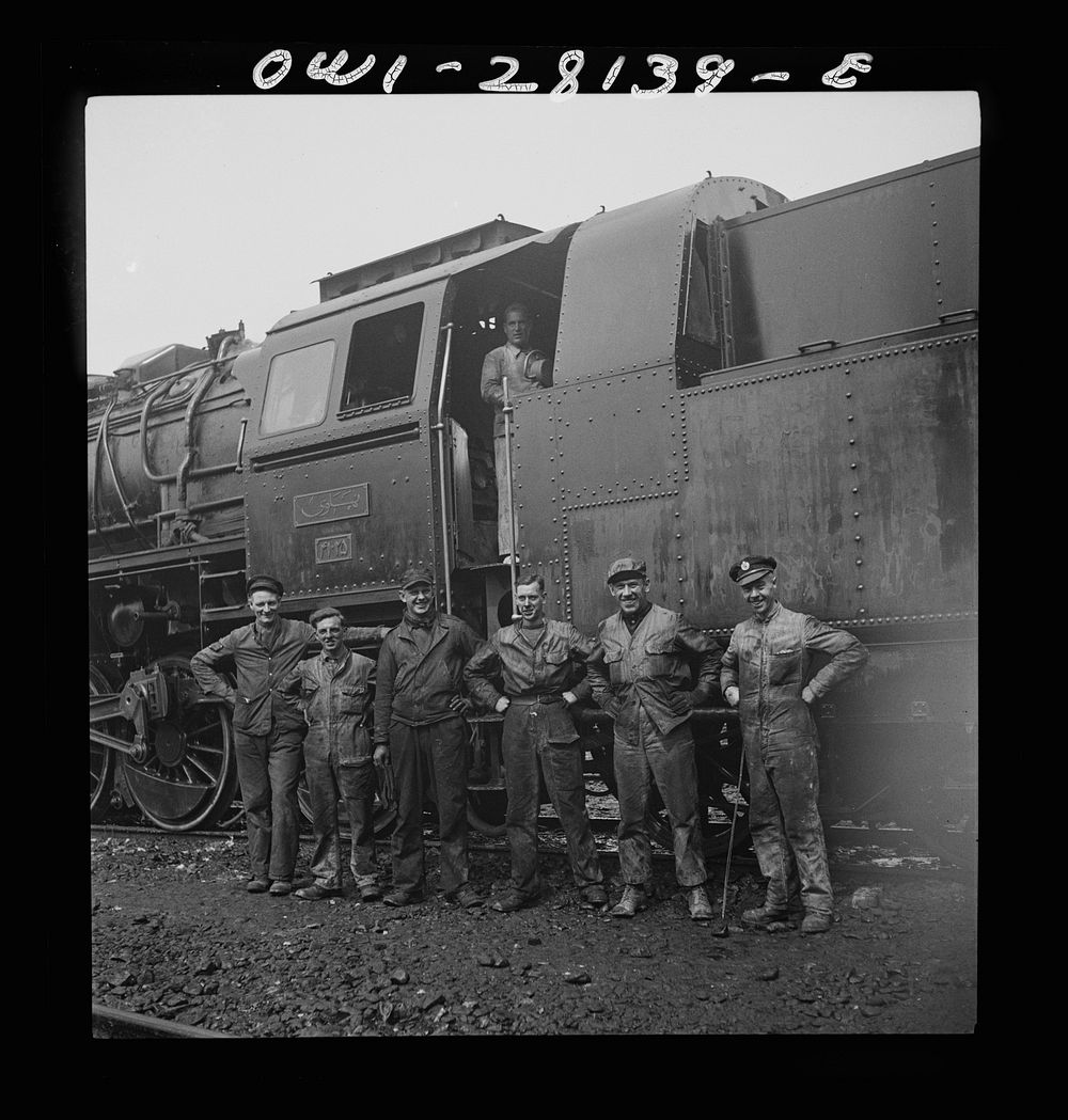 American and British railroad crews who are taking supplies for Russia. Somewhere in Iran. Sourced from the Library of…