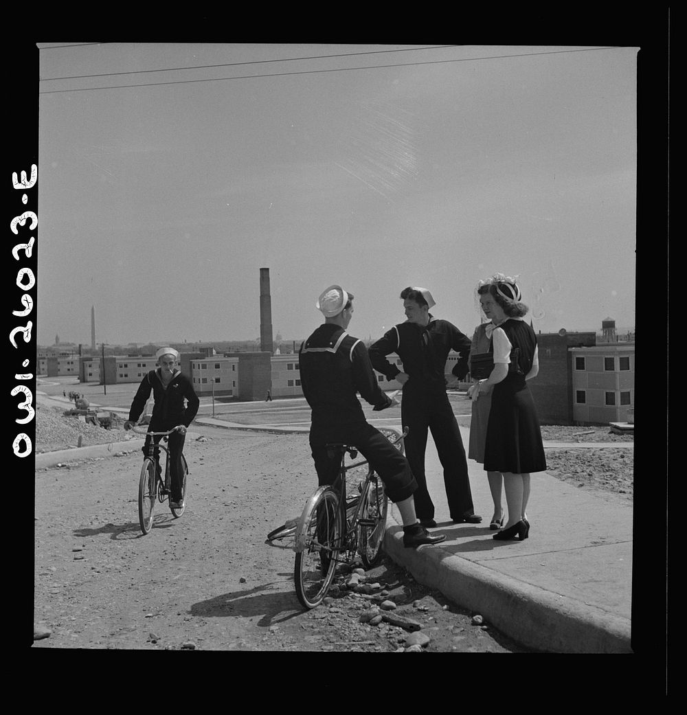 Arlington, Virginia. Sailors bicycled over to Arlington Farms, a residence for women who work in the U.S. government for the…
