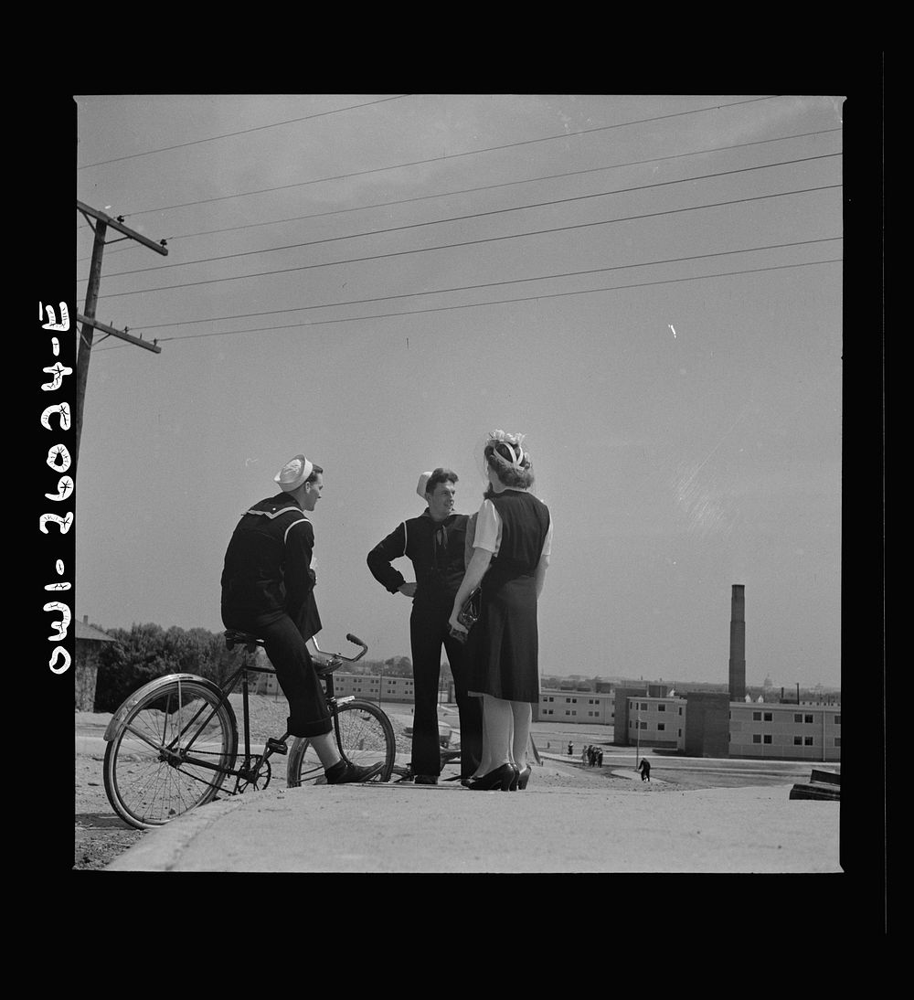 Arlington, Virginia. Sailors bicycled over to Arlington Farms, a residence for women who work in the U.S. government for the…