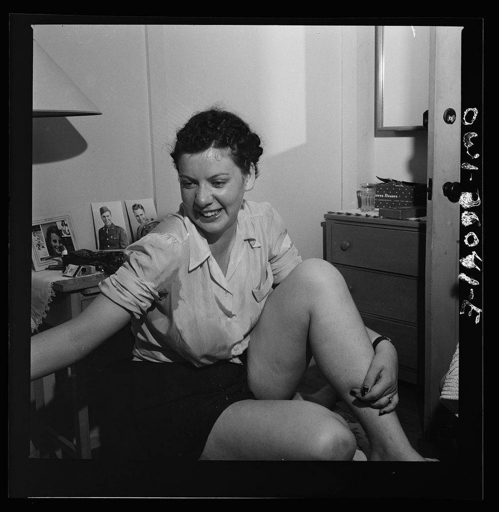 Arlington, Virginia. A girl just coming in from a sunbath at Arlington Farms, a residence for women who work in the U.S.…