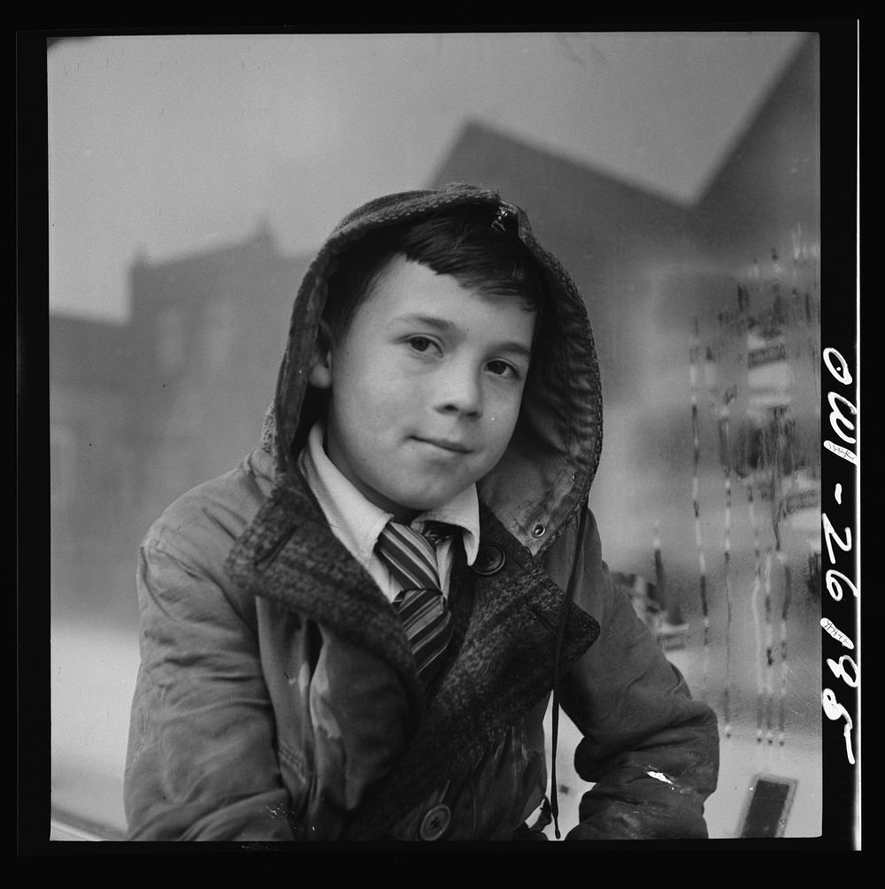 Buffalo, New York. Peter Grimm, age ten, waiting with his wagon outside Loblaw's grocery store for customers to ask him to…