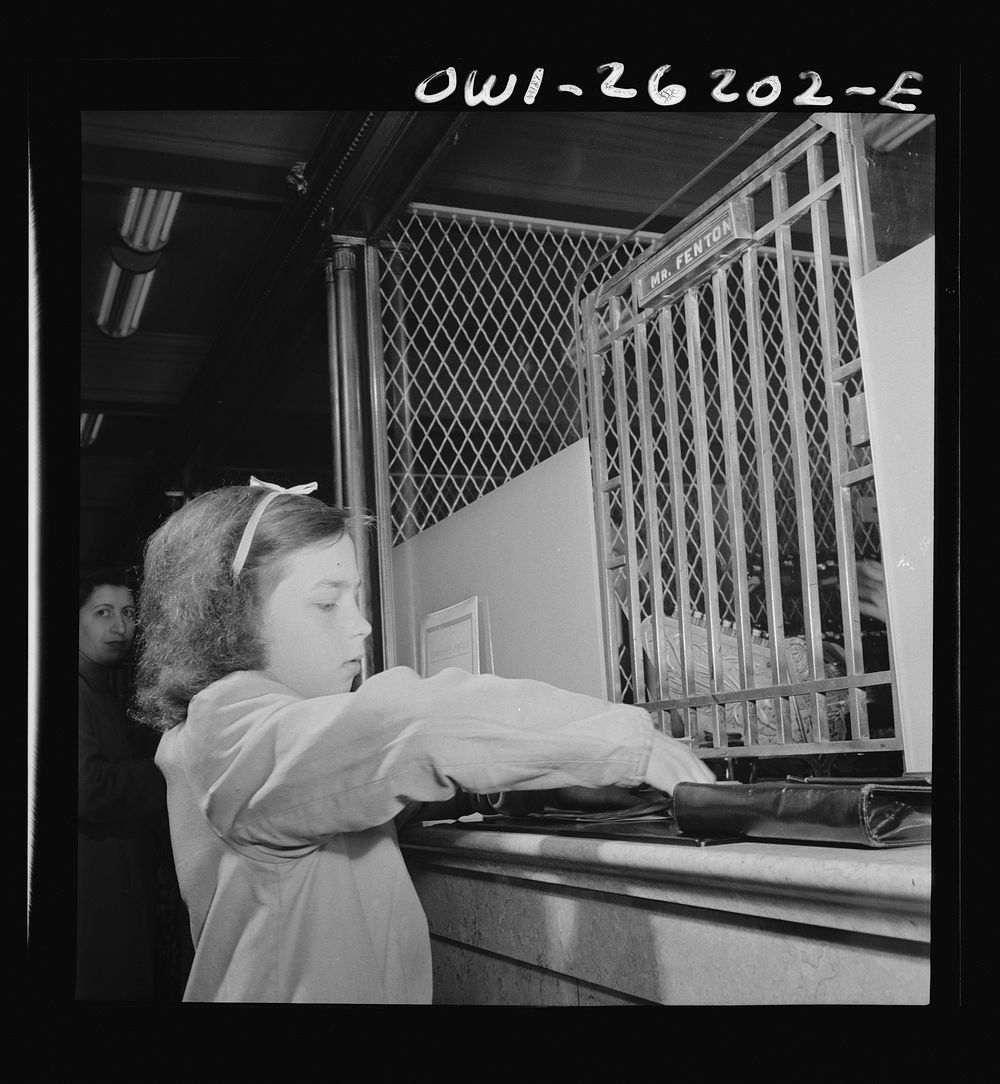 [Untitled photo, possibly related to: Buffalo, New York. Beverly Ann Grimm, eleven, leaving the store after making the…