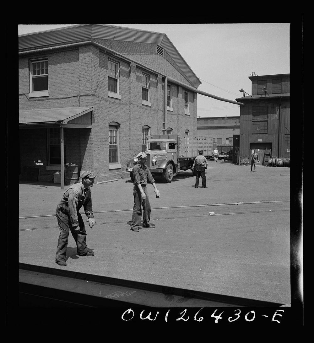 Bethlehem-Fairfield shipyards, Baltimore, Maryland. Playing a game of catch. Sourced from the Library of Congress.