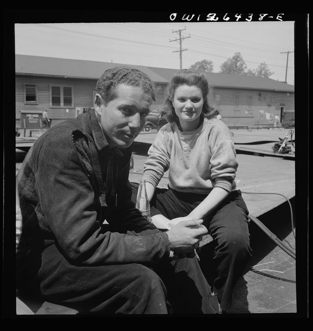 Bethlehem-Fairfield shipyards, Baltimore, Maryland. Boy and girl worker during the lunch hour. Sourced from the Library of…