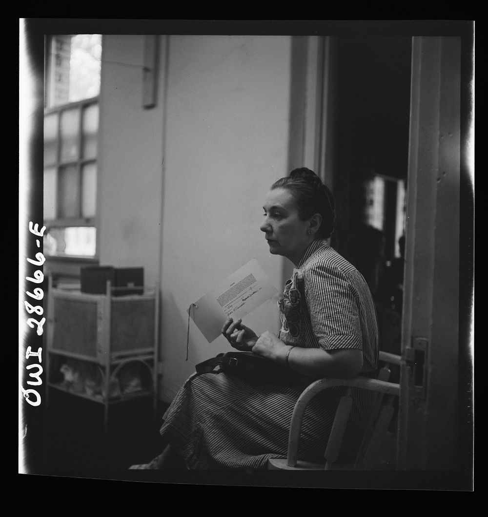 Washington, D.C. Her application blank filled out, a prospective blood donor awaiting the medical examination. Sourced from…