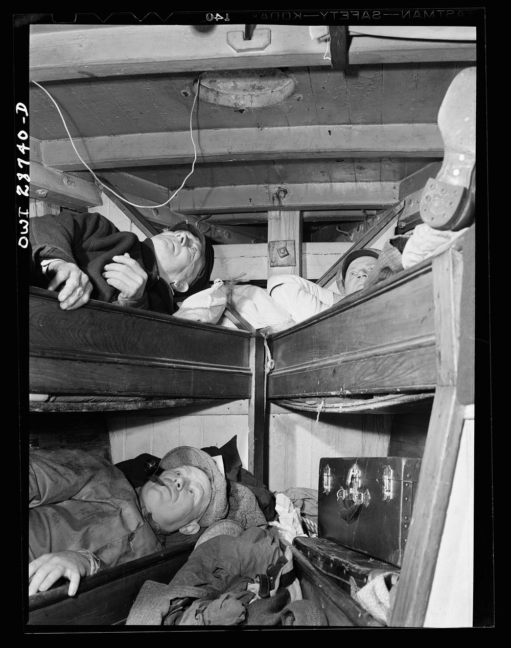 New York, New York. Gloucester fishermen resting in their bunks after unloading their catch at the Fulton fish market.…