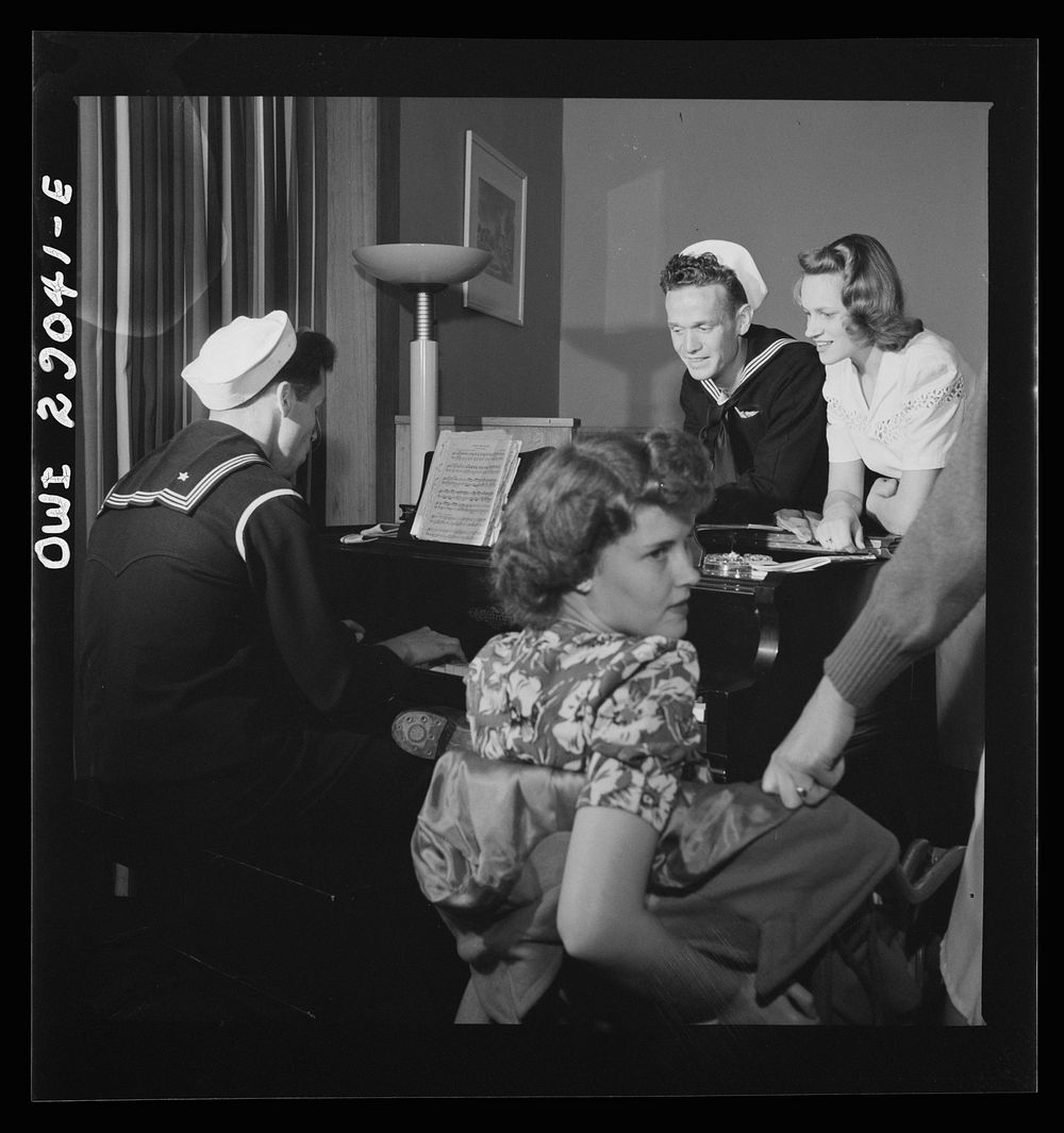 Arlington, Virginia. A group around a piano in the lounge of Idaho Hall, Arlington Farms, a residence for women who work in…
