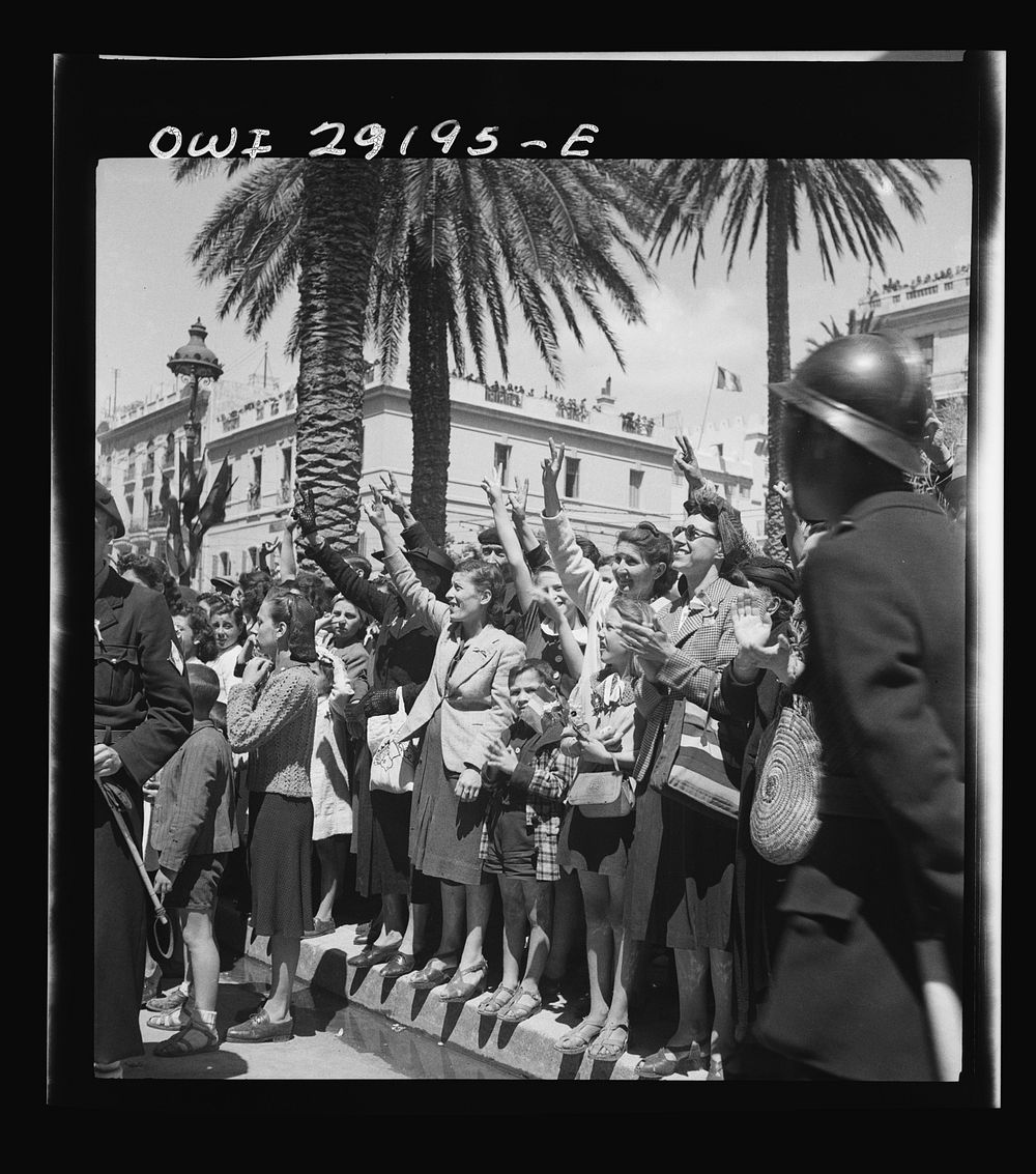 Cheering women and children line the streets to cheer the Allied armies as they march through Tunis. Sourced from the…