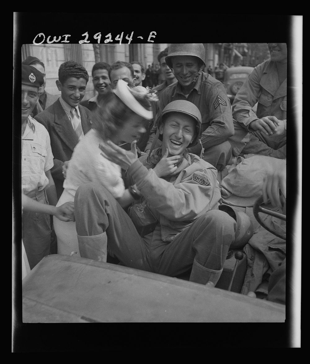 Porto Farina, Tunisia. Girl kissing a United States Army war correspondent. Sourced from the Library of Congress.