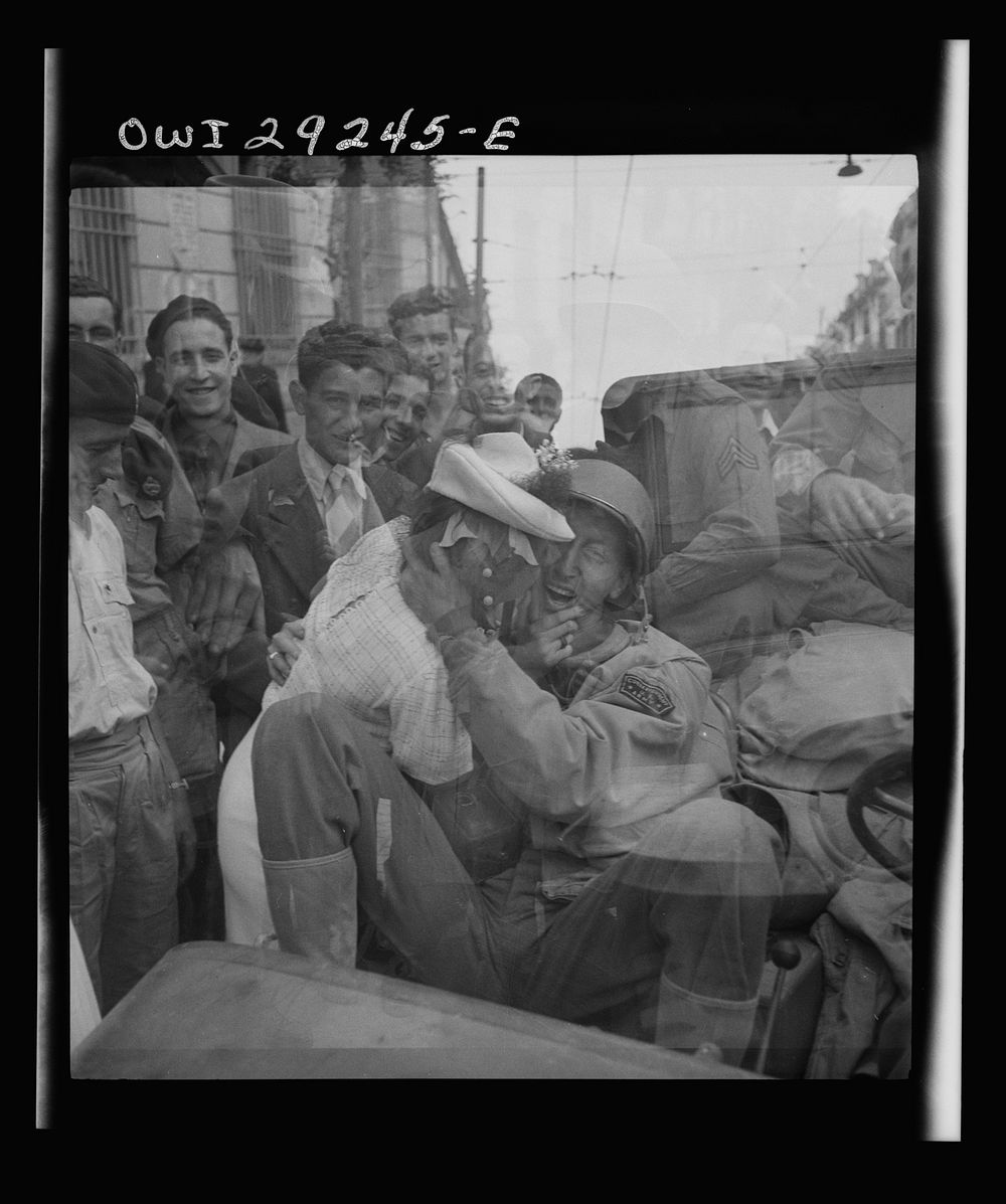 [Untitled photo, possibly related to: Porto Farina, Tunisia. Girl kissing a United States Army war correspondent]. Sourced…
