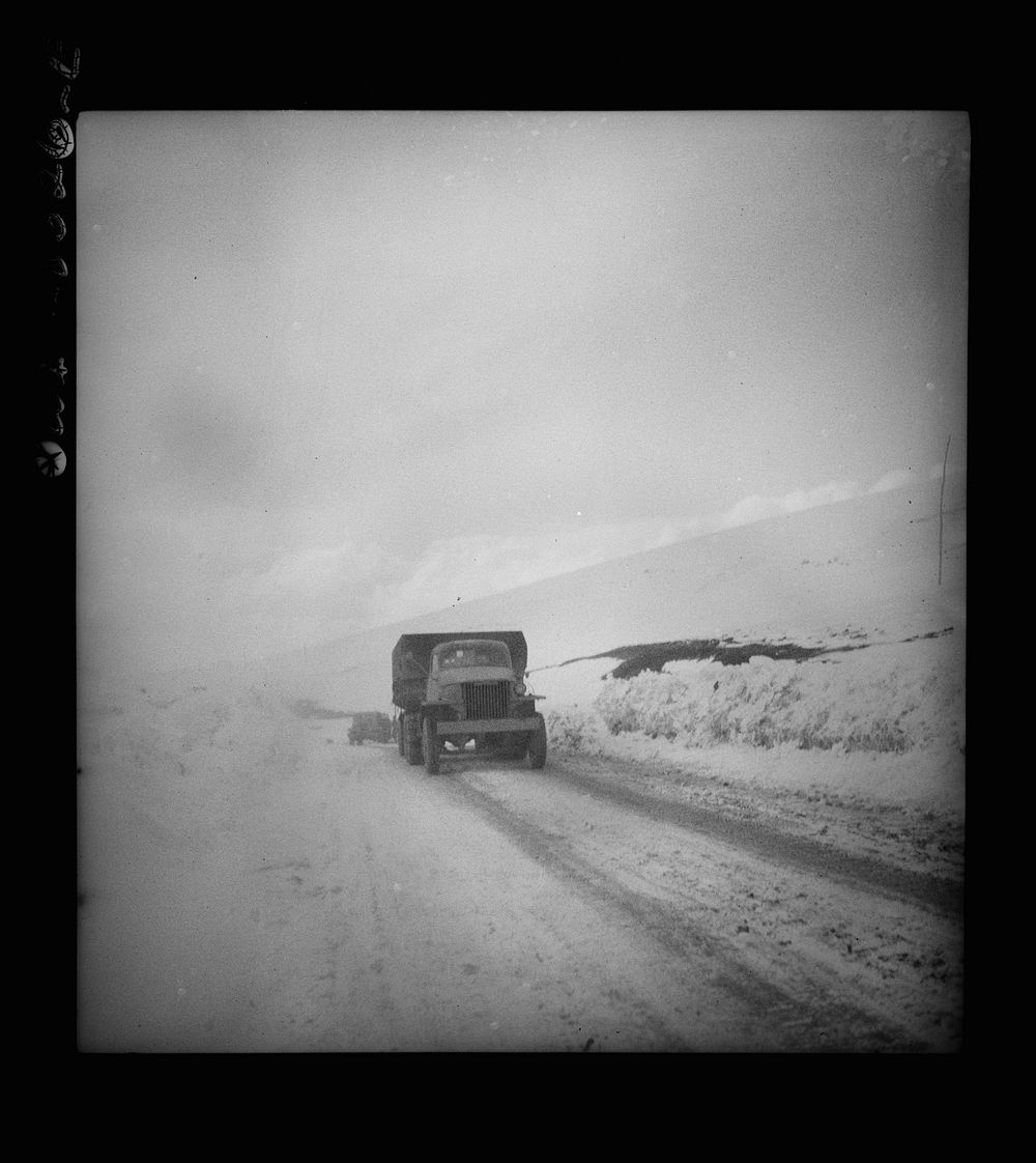 Somewhere in the Persian corridor. A United States Army truck convoy carrying supplies for the aid of Russia making a risky…