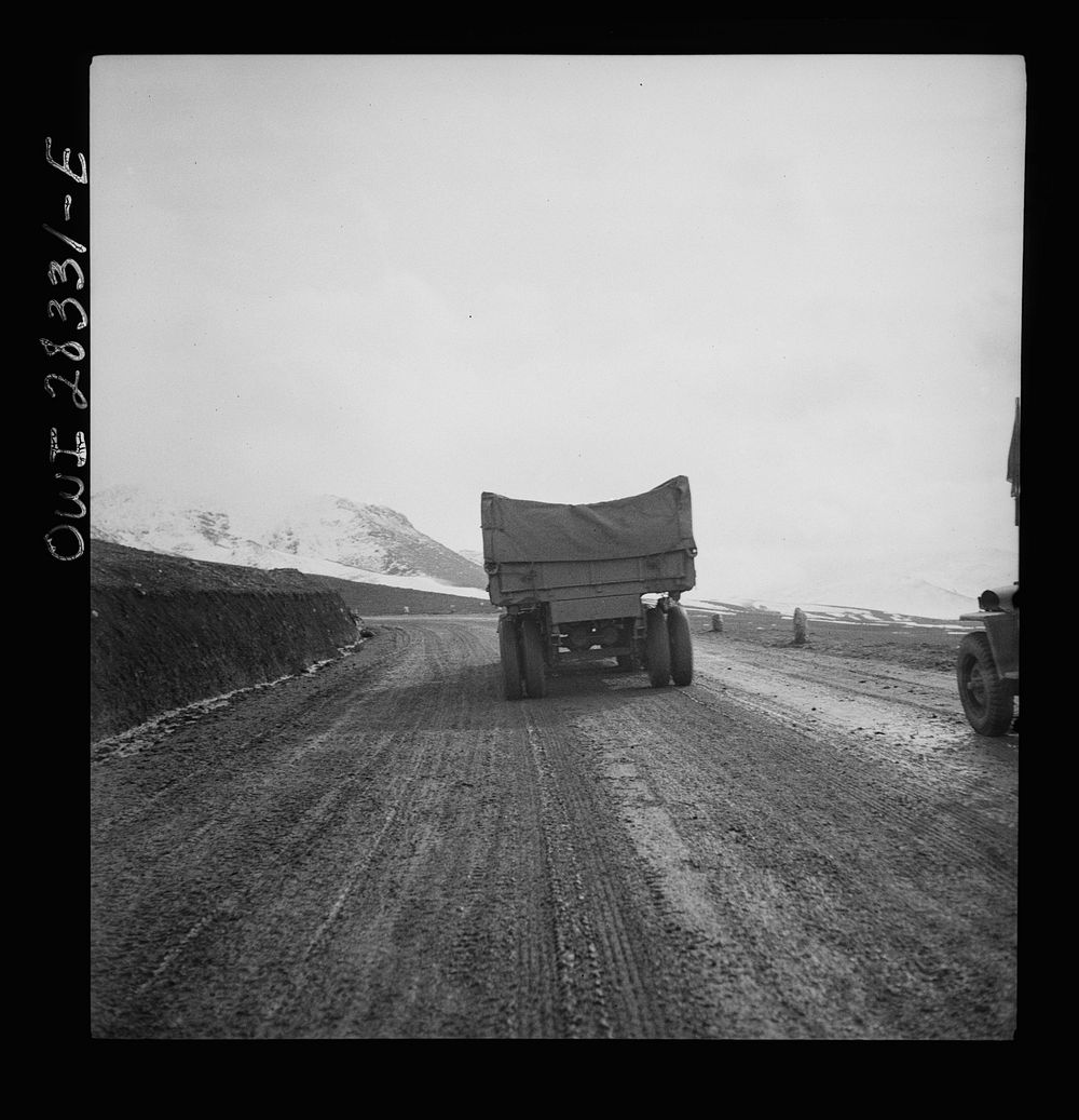 Somewhere in the Persian corridor. A United States Army truck convoy carrying supplies for the aid of Russia climbing a…