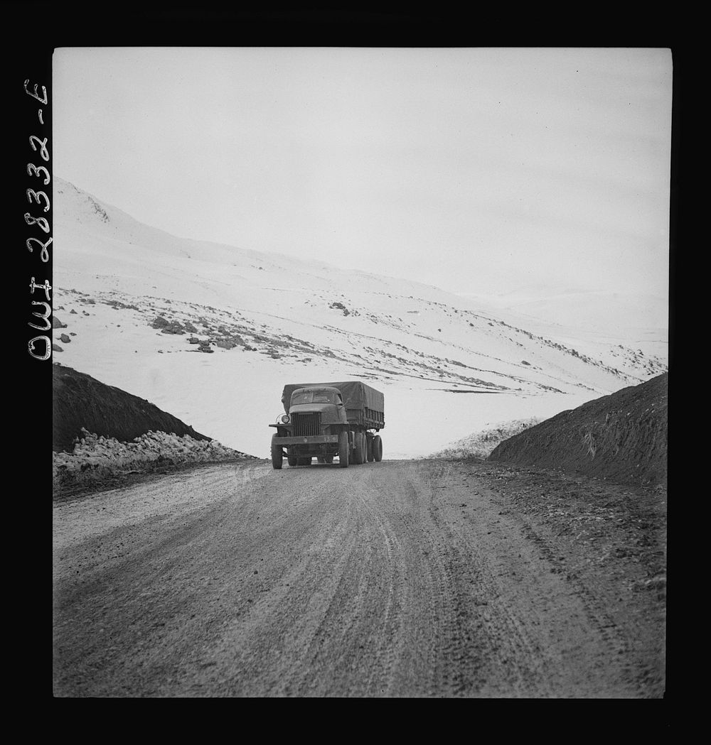 Somewhere in the Persian corridor. A United States Army truck convoy carrying supplies for the aid of Russia climbing a…