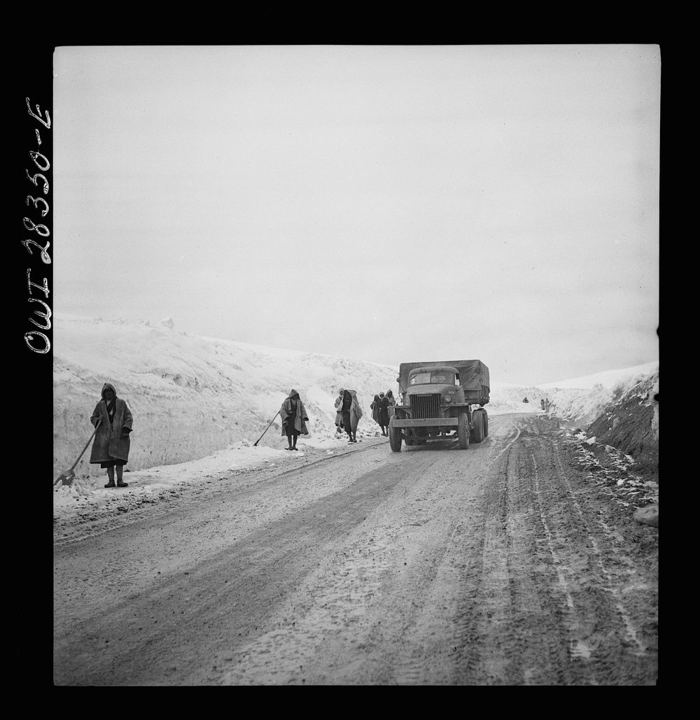 Somewhere in the Persian corridor. A United States Army truck convoy carrying supplies for Russia climbing a snowbound…