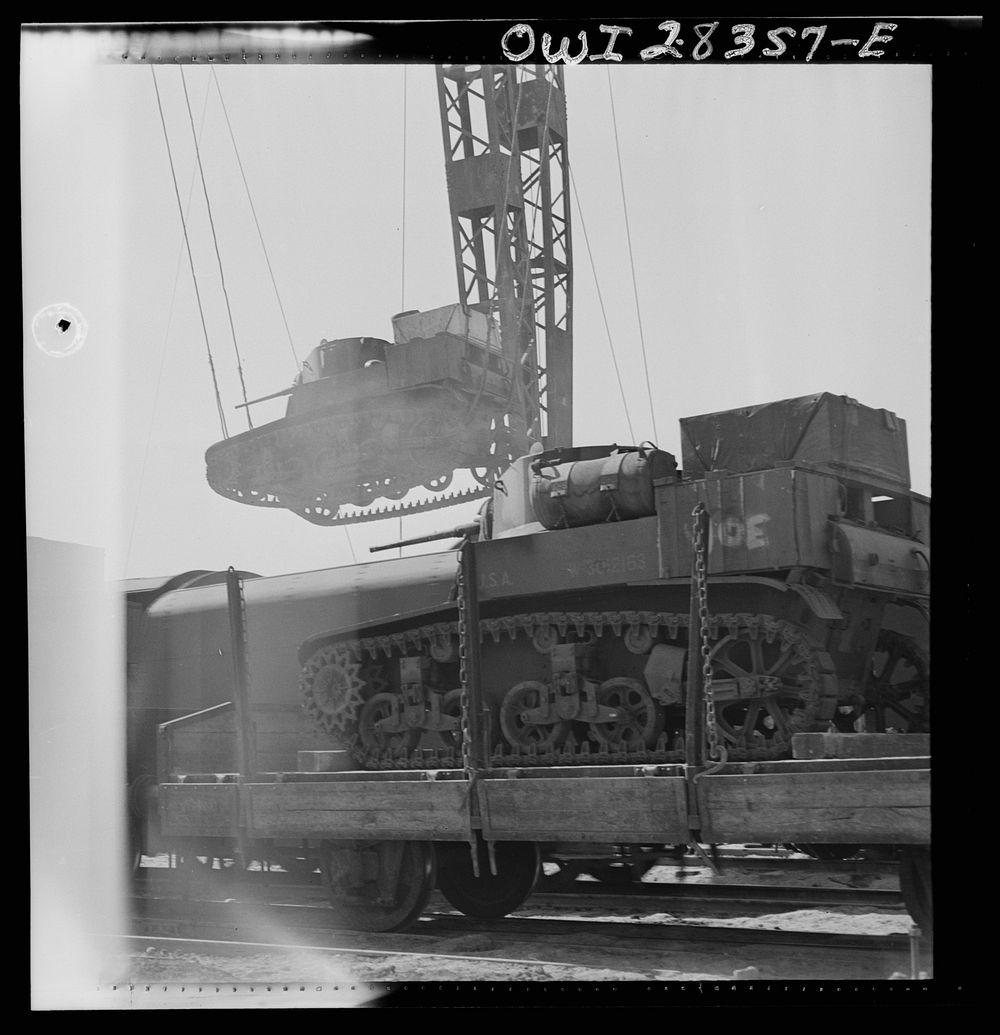 An American tank being loaded onto a railroad car enroute to Russia in the Middle East. Sourced from the Library of Congress.