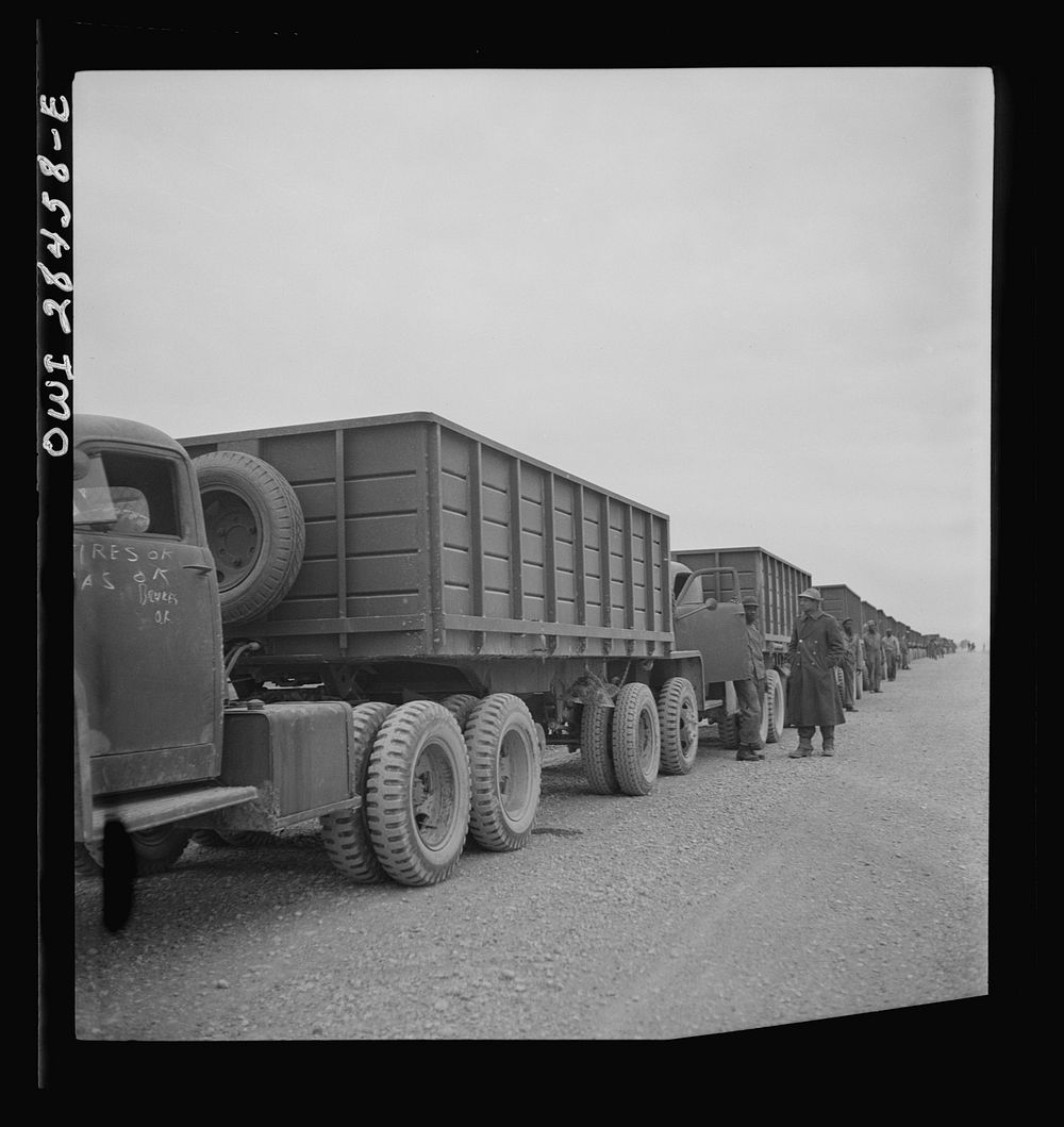 Somewhere in the Persian corridor. A United States Army truck convoy carrying supplies for the aid of Russia stopping for a…