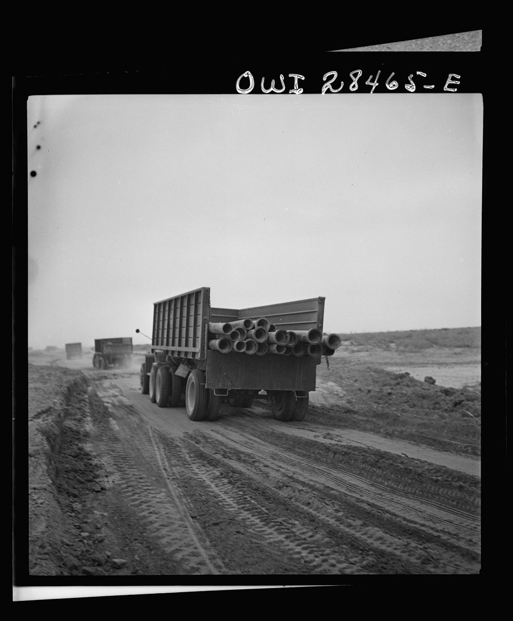 Somewhere in the Persian corridor. A United States Army truck convoy carrying supplies for Russia moving along on a sandy…