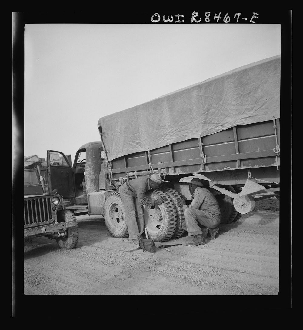 Somewhere in the Persian corridor. A United States Army truck convoy carrying supplies for Russia stopping to check trucks…