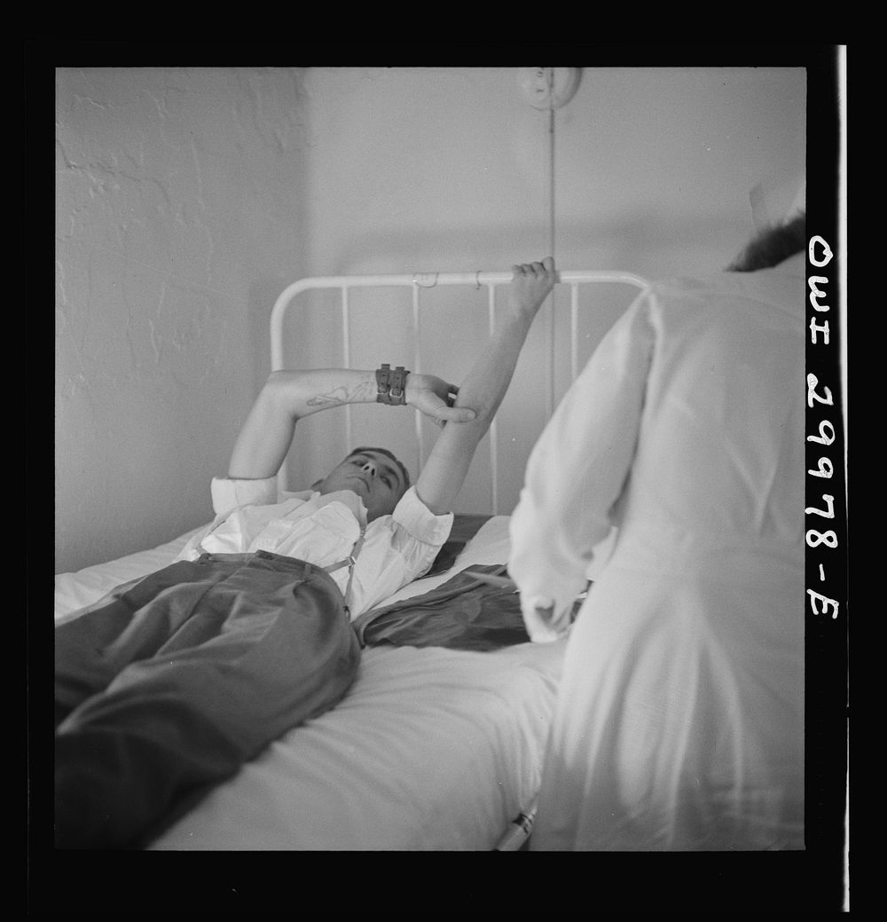 Washington, D.C. After giving blood, a donor must hold his arm in this position for a few minutes. Sourced from the Library…