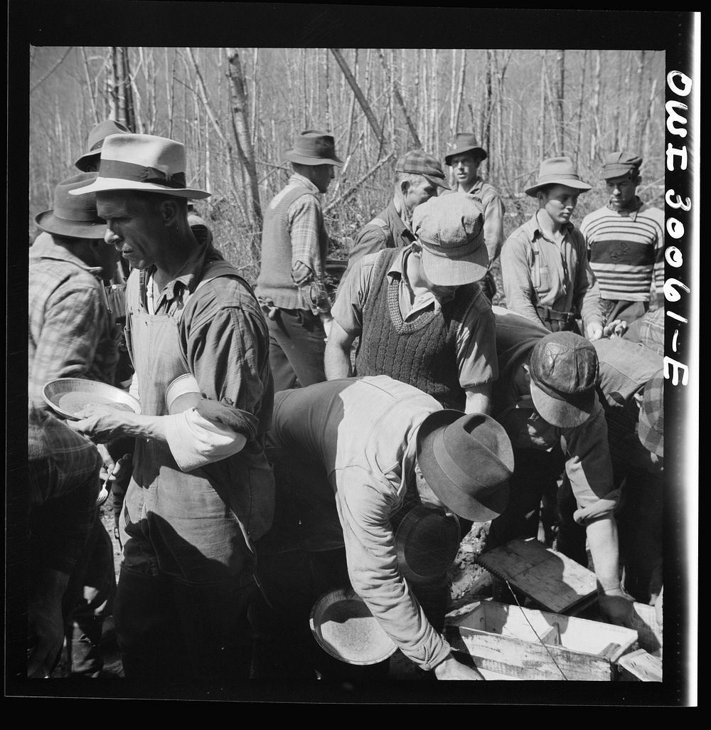[Untitled photo, possibly related to: Spring pulpwood drive on the Brown Company timber holdings in Maine. Woodsmen serve…