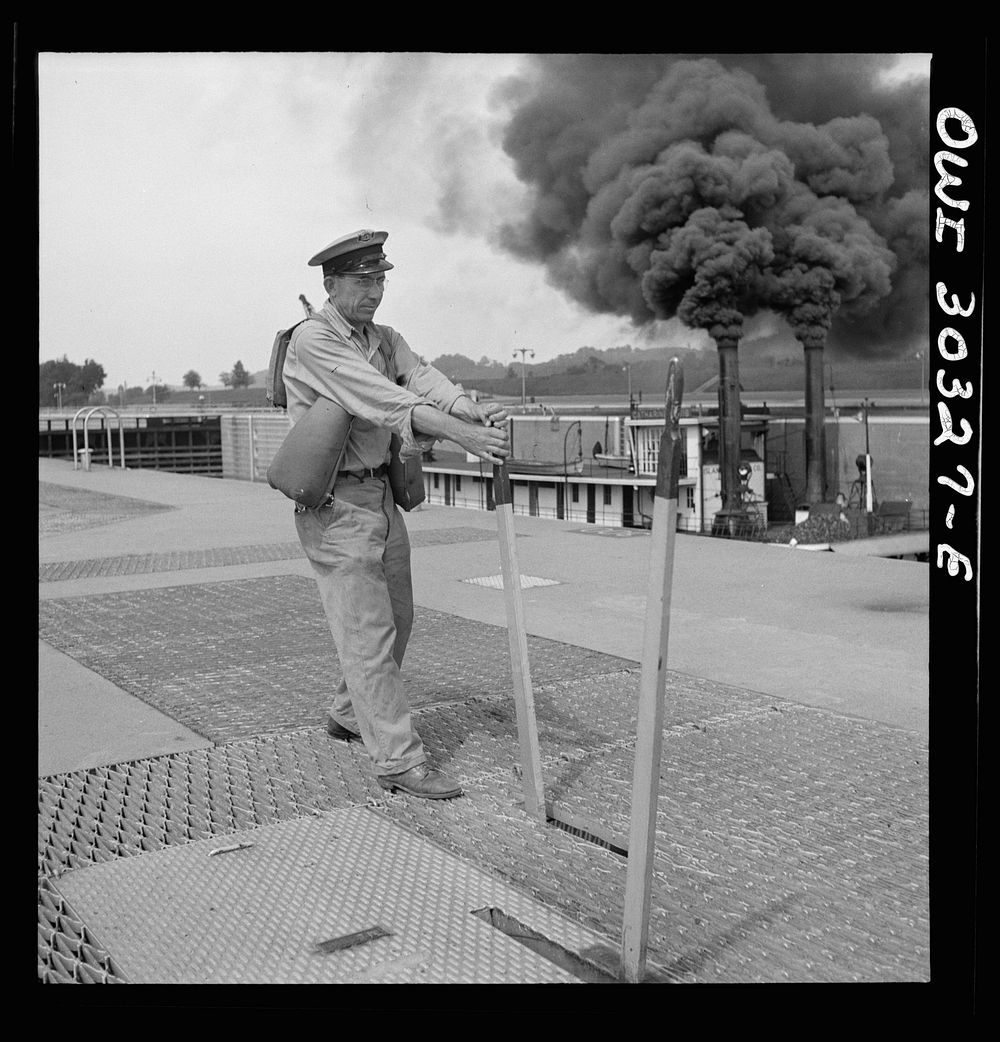 Gallipolis, Ohio. Gate man opening front gate of Gallipolis lock as steamboat goes through. Sourced from the Library of…