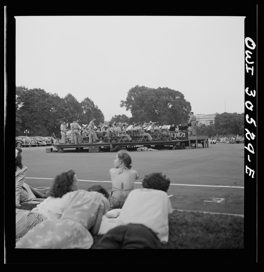 [Untitled photo, possibly related to: Washington, D.C. Listening to the U.S. Army band play at a free concert in front of…