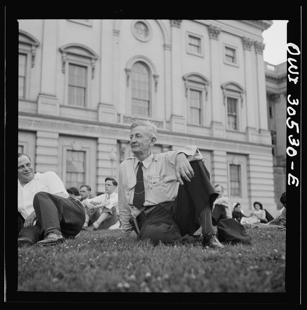 Washington, D.C. Listening to the U.S. Army band play at a free concert in front of the Capitol. Sourced from the Library of…