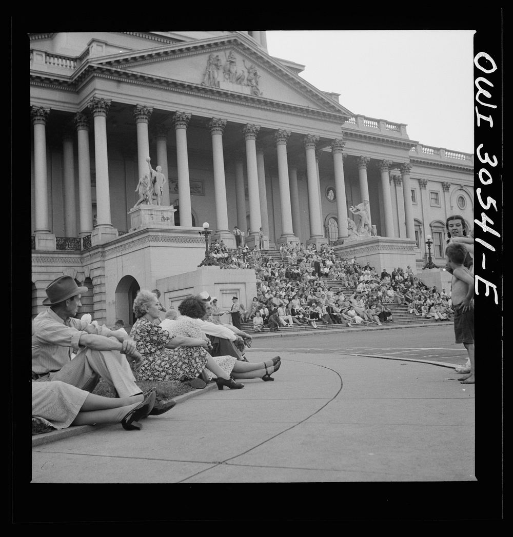 [Untitled photo, possibly related to: Washington, D.C. Listening to U.S. Army band play at a free concert in front of the…