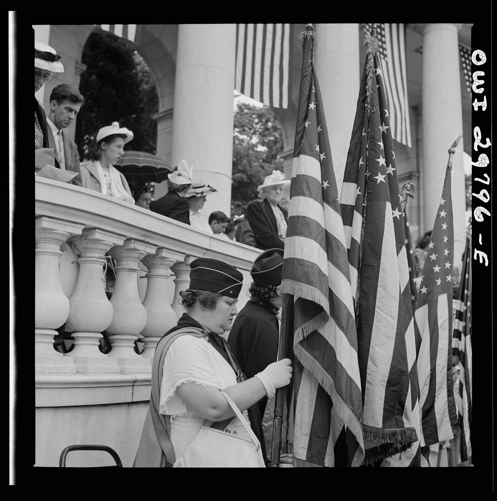 [Untitled photo, possibly related to: Arlington Cemetery, Arlington, Virginia. American Legion color bearer listening to…