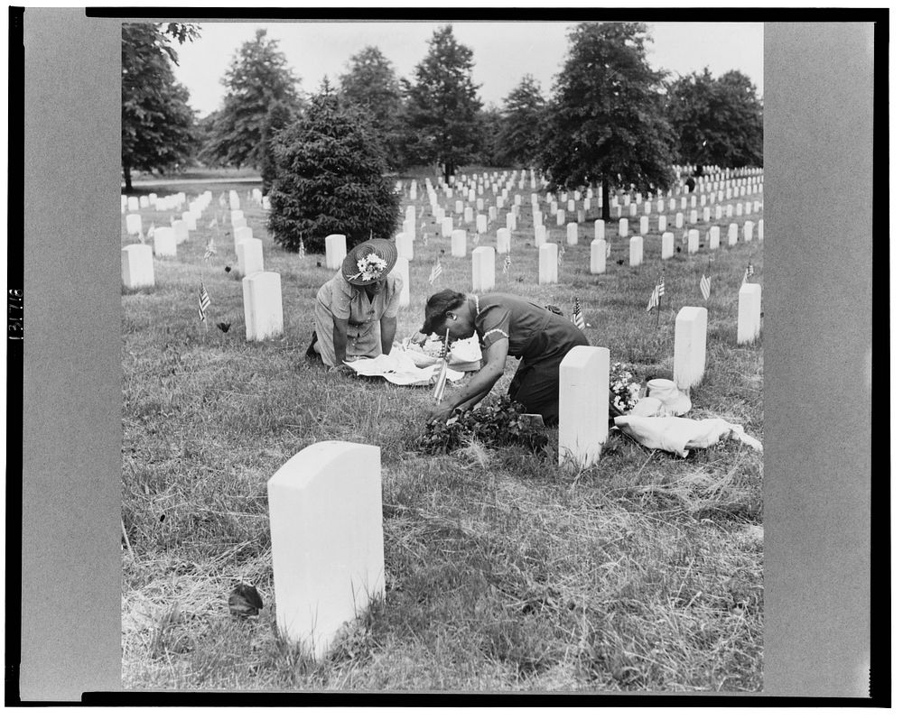 Arlington Cemetery, Arlington, Virginia. Decorating a soldier's grave in one of the  sections on Memorial Day. Sourced from…