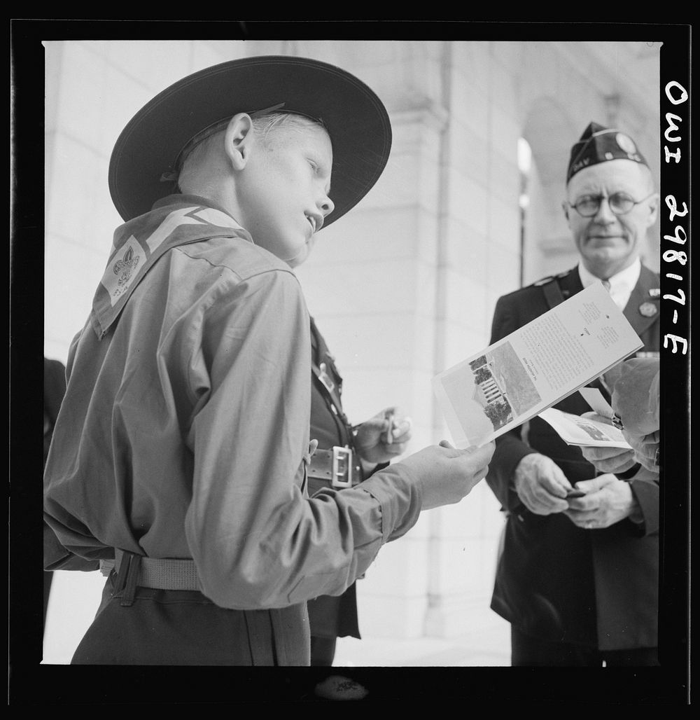 Arlington Cemetery, Arlington, Virginia. A boy scout giving out programs at the Memorial Day services. Sourced from the…