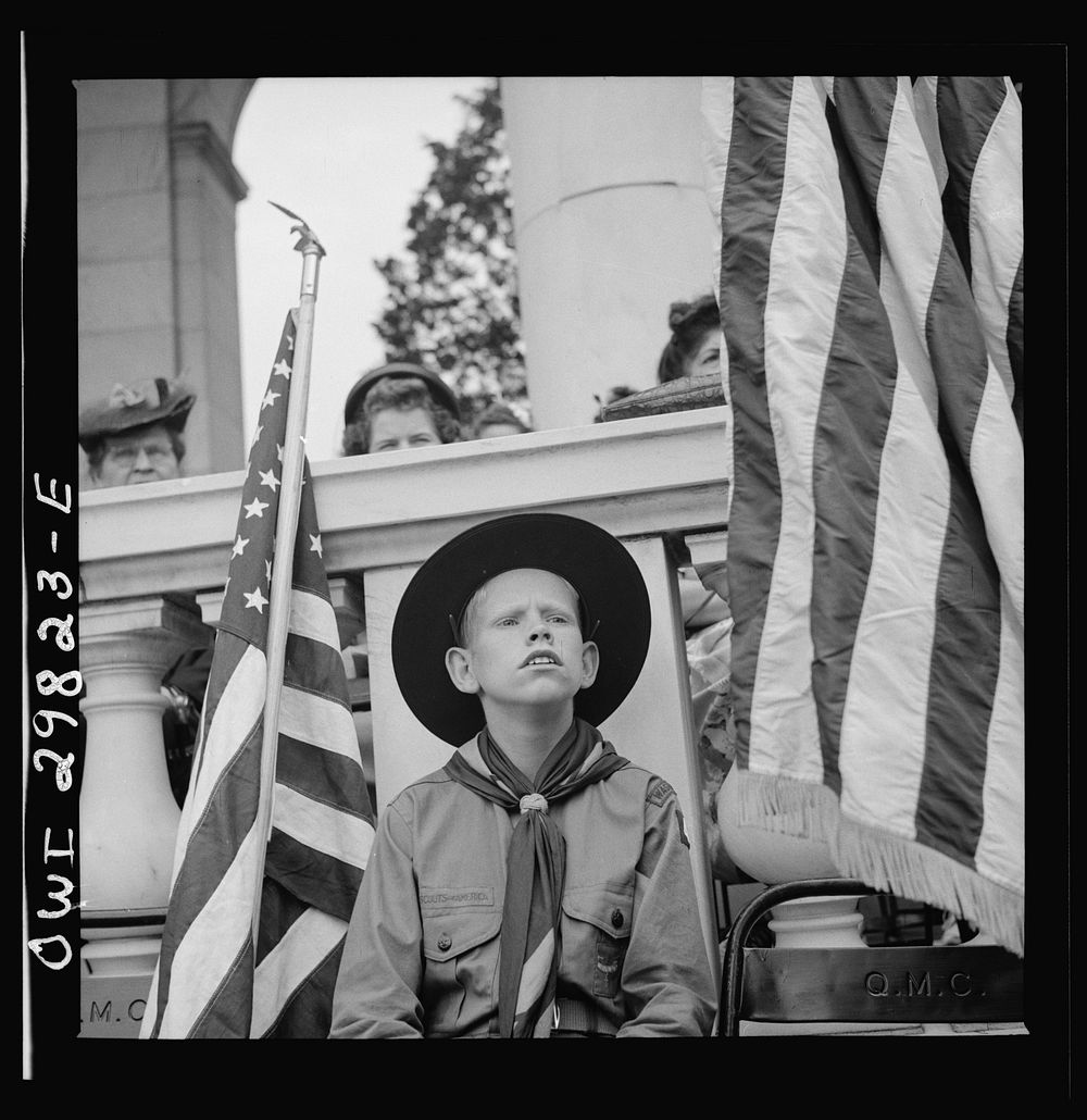 Arlington Cemetery, Arlington, Virginia. Boy scout color bearer listening to the Memorial Day ceremony. Sourced from the…