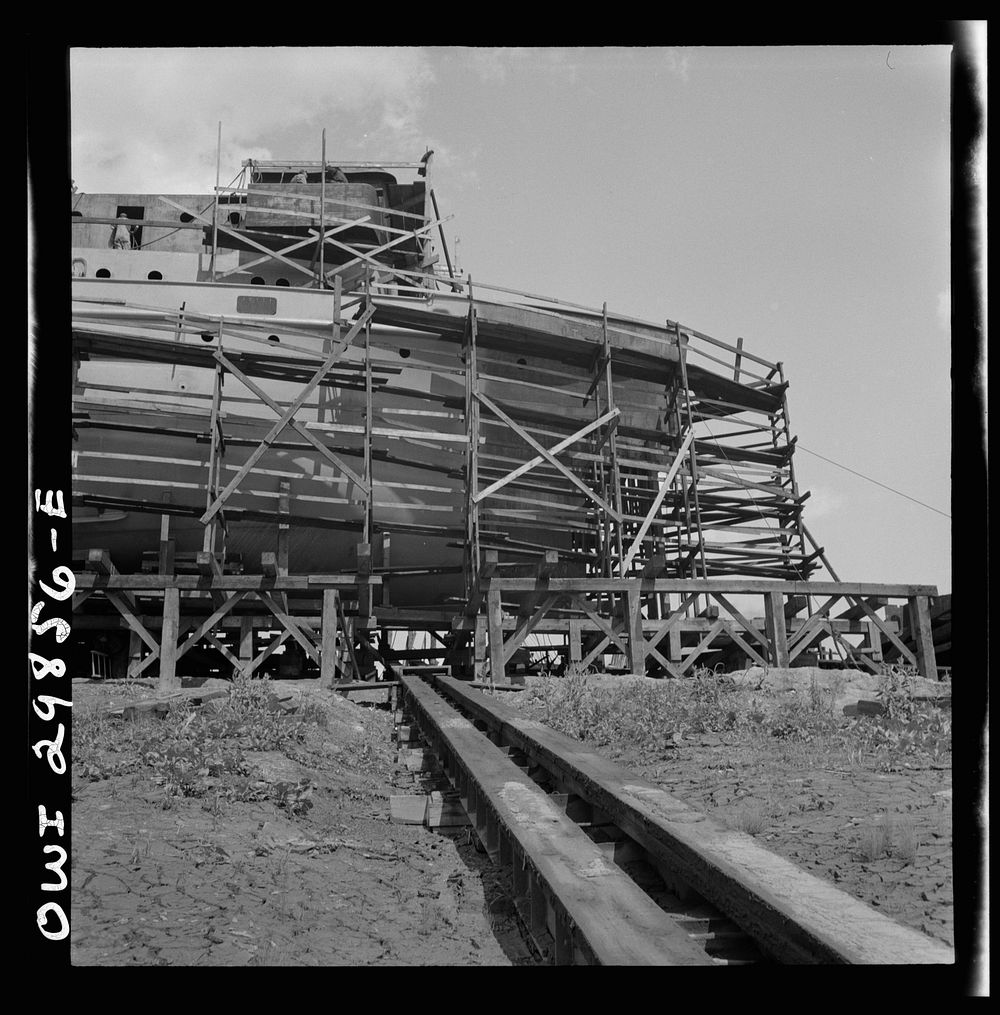 Point Pleasant, West Virginia. Scaffolding around a United States Army LT boat at the Marietta Manufacturing Company.…