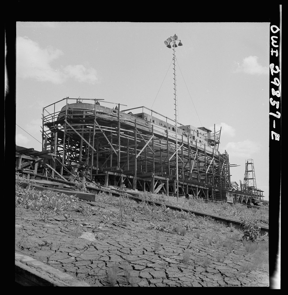 Point Pleasant, West Virginia. Scaffolding around a United States Army LT boat at the Marietta Manufacturing Company.…