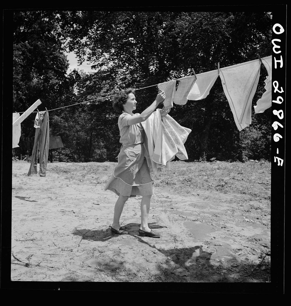 Point Pleasant, West Virginia. Mrs. Fergusen taking clothes off the line. Sourced from the Library of Congress.
