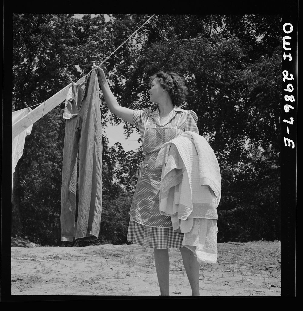 Point Pleasant, West Virginia. Mrs. Fergusen taking the clothes off the line. Sourced from the Library of Congress.