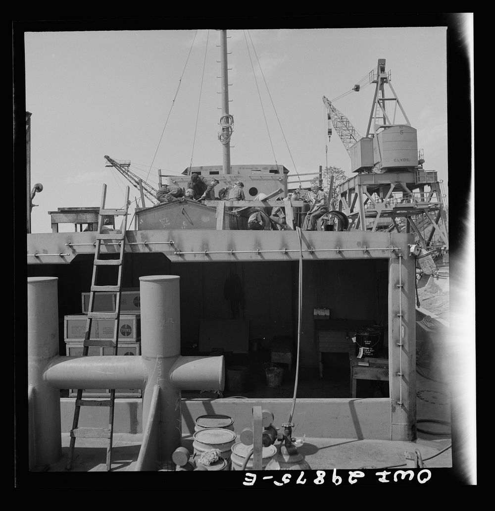 Point Pleasant, West Virginia. Workmen on a United States Army LT boat at the Marietta Manufacturing Company. Sourced from…