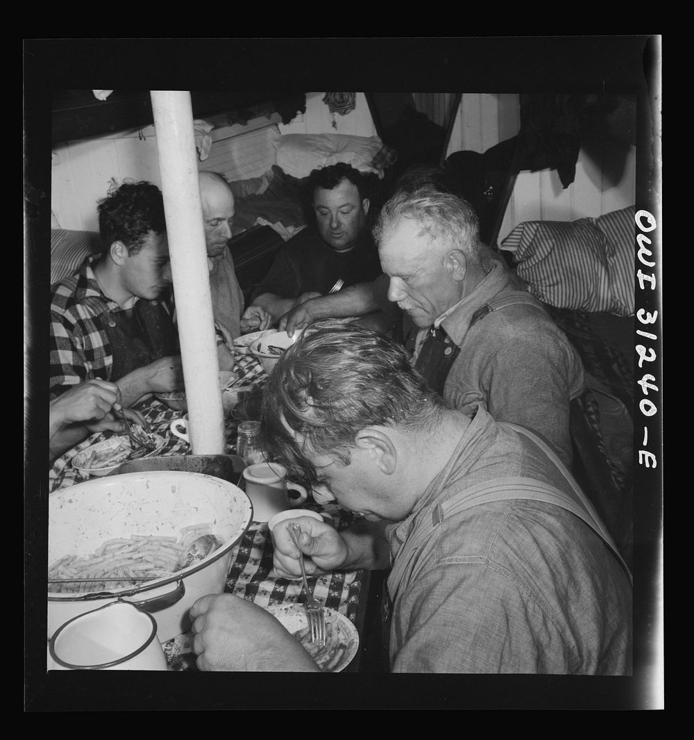 On board the fishing boat Alden, out of Gloucester, Massachusetts. Italian spaghetti is served after a hard day's work. The…