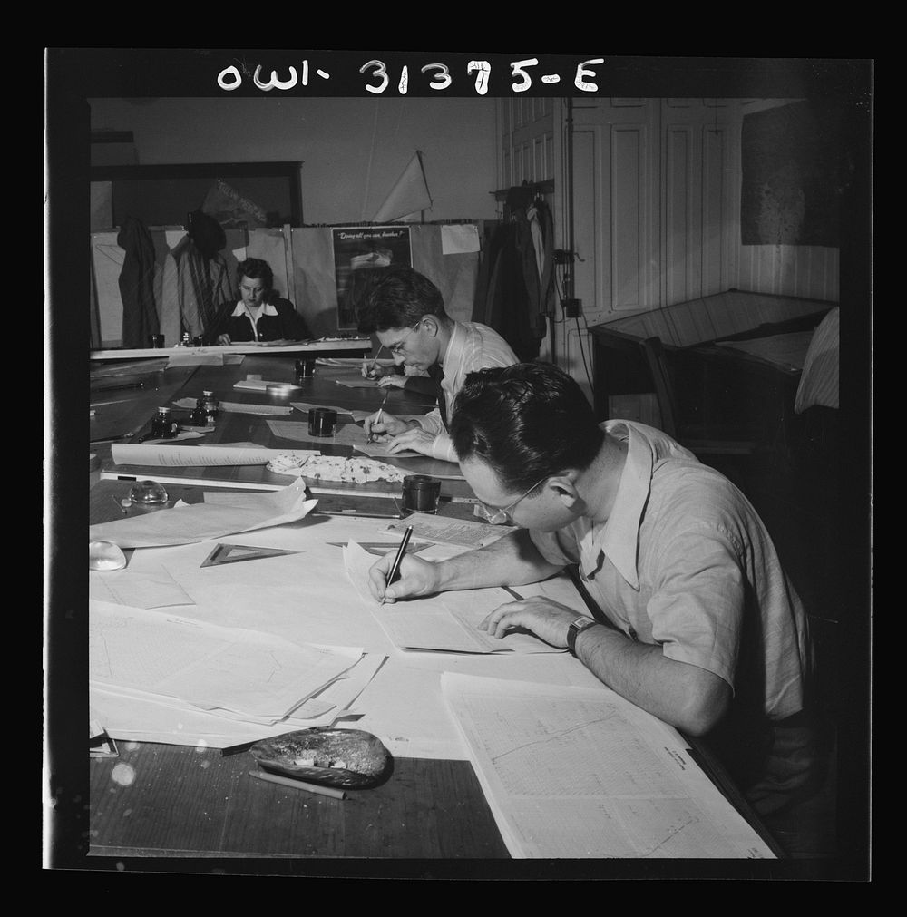 Washington, D.C. Preparing an advisory forecast at the U.S. Weather Bureau. General view of plotting room. Sourced from the…