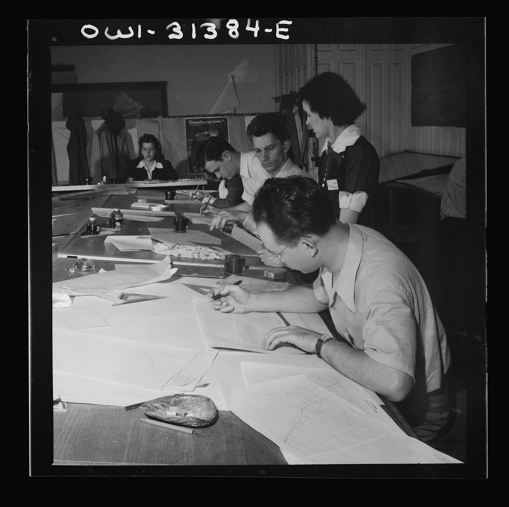 Washington, D.C. Preparing an advisory forecast at the U.S. Weather Bureau. General view of the plotting room. Sourced from…