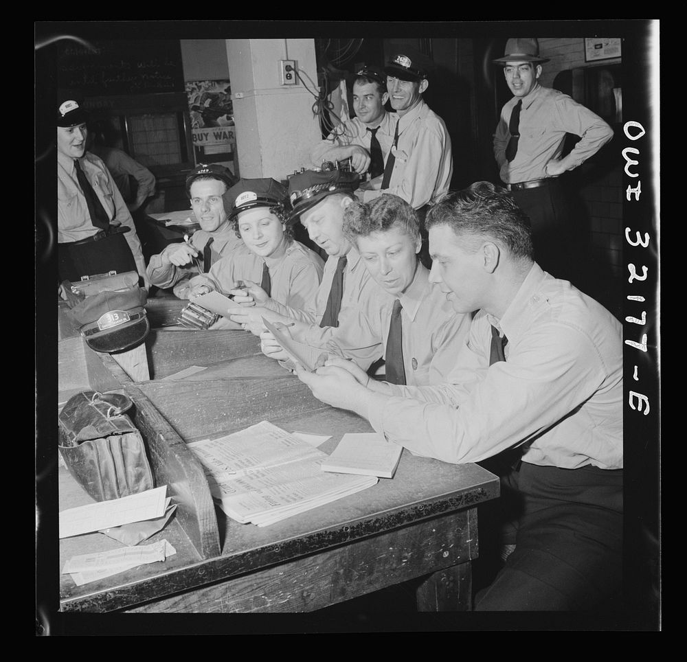 Washington, D.C. Captiol transit streetcar and bus operators checking their daily receipts. The women are Frances Lewis and…