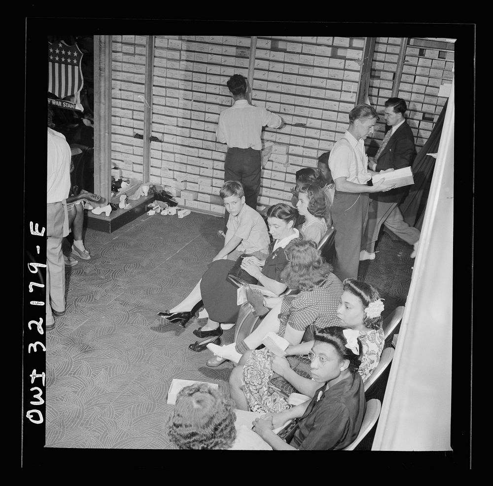 Washington, D.C. A crowded shoe store on the last day on which war ration shoe coupon seventeen may be used. Sourced from…