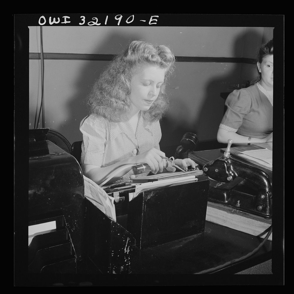 [Untitled photo, possibly related to: Washington, D.C. Jean Smith sending a Western Union telegram on the teleprinter to New…